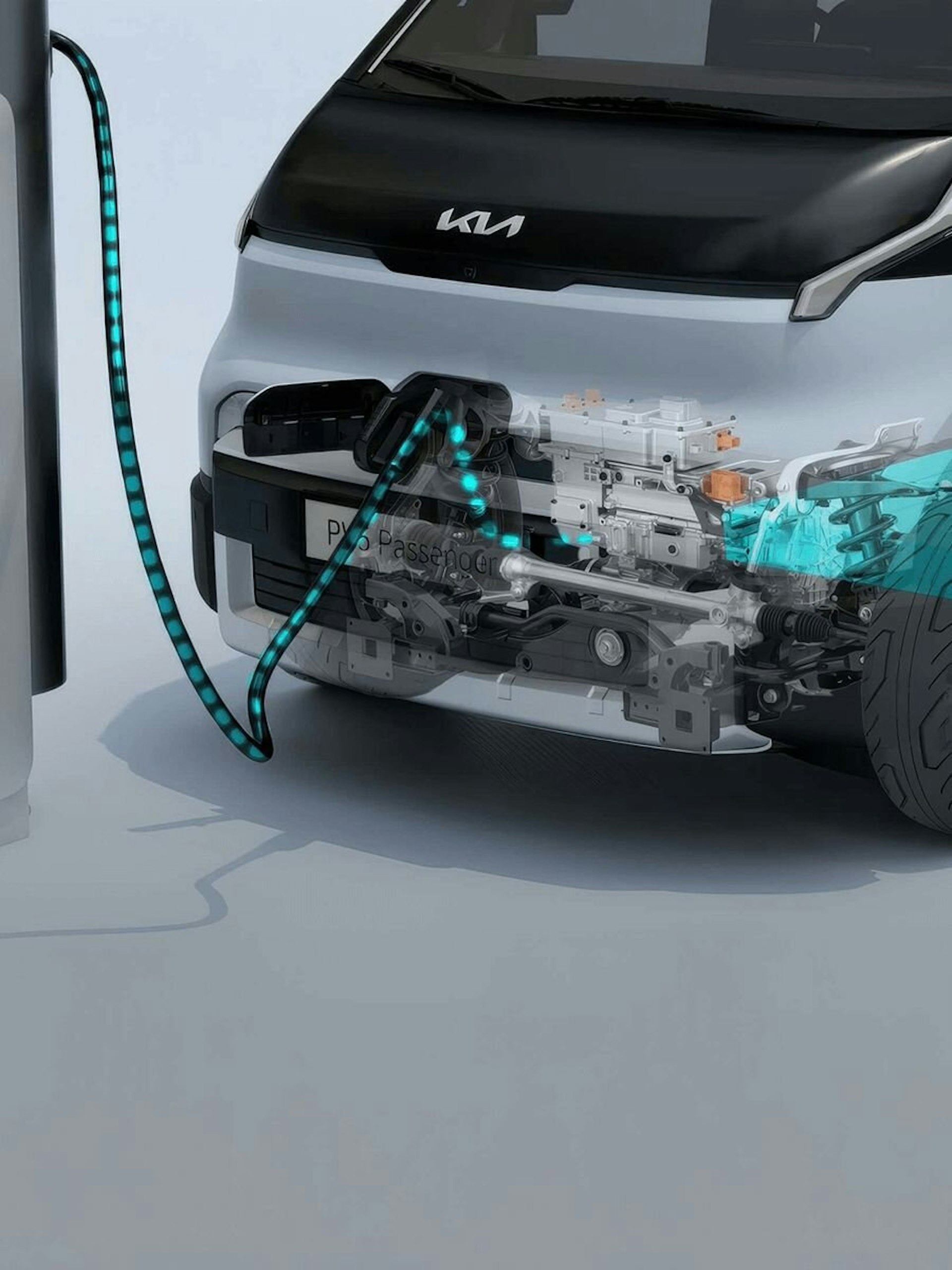 Nahaufnahme des vorderen Ladeanschlusses des Kia PV5 Passenger mit verbundenem Kabel